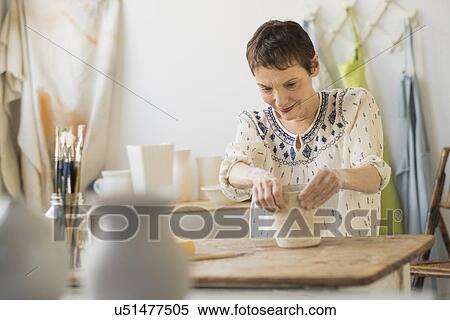 Senior woman making bowl at workshop View Large Photo Image Stock Photography - Senior woman making bowl at workshop. Fotosearch