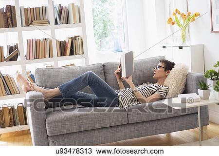 Senior woman reading book on sofa View Large Photo Image Stock Image - Senior woman reading book on sofa. Fotosearch