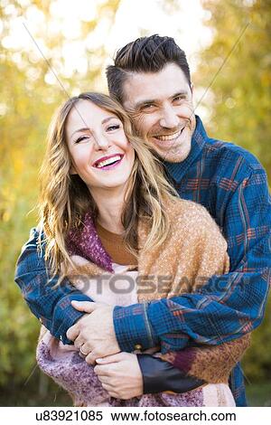 Stock Photography - Smiling mid-adult couple. Fotosearch