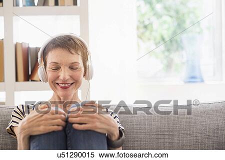 Smiling senior woman with headphones View Large Photo Image Stock Photography - Smiling senior woman with headphones. Fotosearch