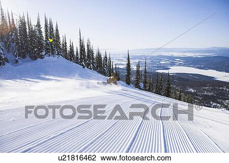 Snowboarder on side of ski slope View Large Photo Image Stock Image - Snowboarder on side of ski slope. Fotosearch