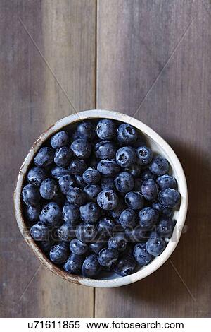 Stack of blueberries in bowl View Large Photo Image Stock Photography - Stack of blueberries in bowl. Fotosearch