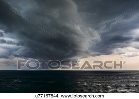 Picture - Storm clouds over sea. Fotosearch