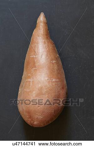 Sweet potato on black background View Large Photo Image Stock Image - Sweet potato on black background. Fotosearch