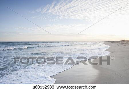 Stock Image - View of beach by sea. Fotosearch