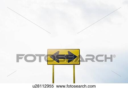 Stock Photography - View of road sign on cloudy day. Fotosearch