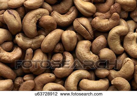 Stock Image - Whole roasted cashews. Fotosearch