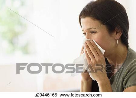 Woman blowing her nose View Large Photo Image Stock Photography - Woman blowing her nose. Fotosearch