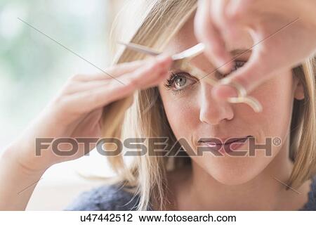 Woman cutting hair View Large Photo Image Stock Image - Woman cutting hair. Fotosearch
