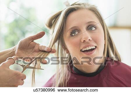 Woman getting haircut View Large Photo Image Stock Photograph - Woman getting haircut. Fotosearch