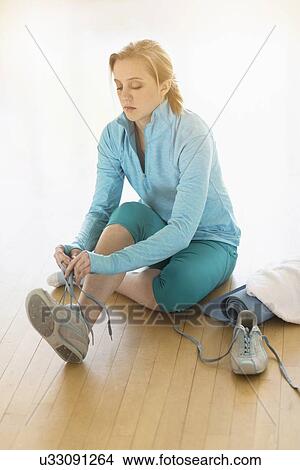 Picture - Woman getting ready for exercise. Fotosearch