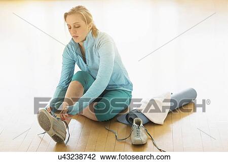 Woman getting ready for exercise View Large Photo Image Stock Image - Woman getting ready for exercise. Fotosearch