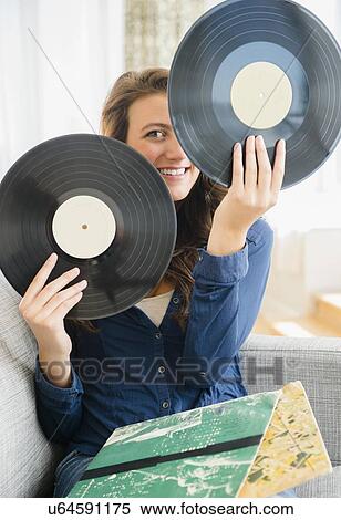 Woman holding two vinyl records View Large Photo Image Stock Photography - Woman holding two vinyl records. Fotosearch