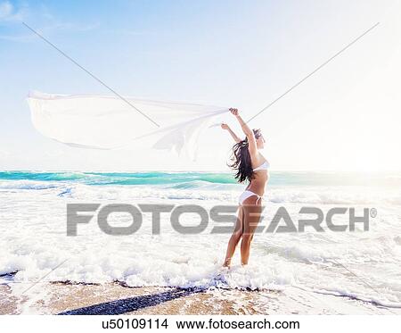 Woman in white bikini on beach View Large Photo Image Picture - Woman in white bikini on beach. Fotosearch