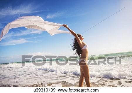 Woman in white bikini on beach View Large Photo Image Stock Photo - Woman in white bikini on beach. Fotosearch