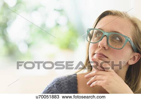 Stock Image - Woman looking up. Fotosearch