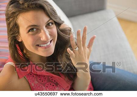 Woman showing engagement ring View Large Photo Image Stock Photo - Woman showing engagement ring. Fotosearch