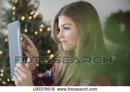Woman taking photo with digital tablet View Large Photo Image Stock Photo - Woman taking photo with digital tablet. Fotosearch