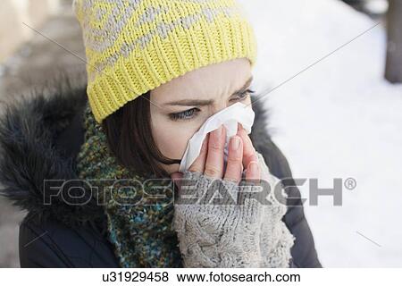 Woman using tissue View Large Photo Image Stock Photo - Woman using tissue. Fotosearch