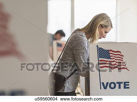 Woman voting on election day View Large Photo Image Picture - Woman voting on election day. Fotosearch