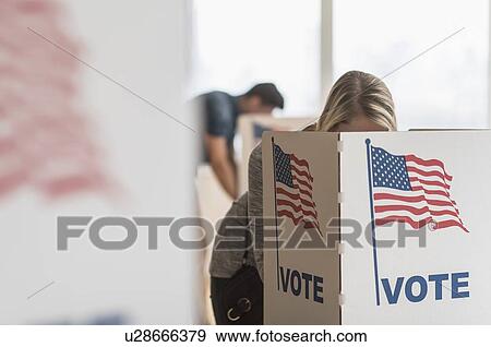 Woman voting on election day View Large Photo Image Stock Photo - Woman voting on election day. Fotosearch