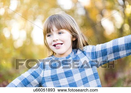 Young girl (4-5) with arms outstretched View Large Photo Image Stock Image - Young girl (4-5) with arms outstretched. Fotosearch