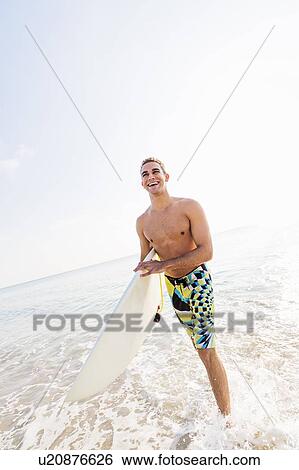 Young surfer laughing View Large Photo Image Stock Photograph - Young surfer laughing. Fotosearch