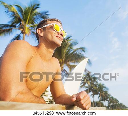 Young surfer smiling View Large Photo Image Stock Photo - Young surfer smiling. Fotosearch