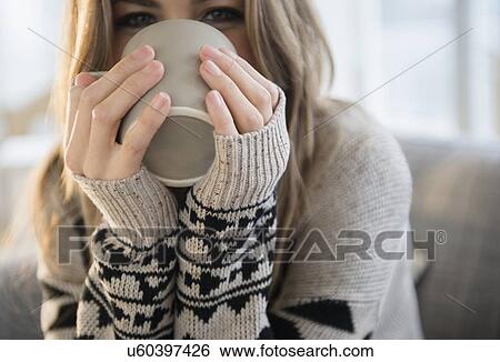 Stock Photograph - Young woman with mug. Fotosearch