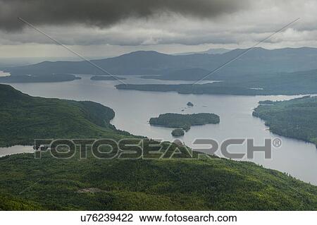 Stock Image - "Aerial view of islands in a lake, Skeena-Queen Charlotte Regional District, Haida Gwaii, Graham Island, British Columbia, Canada". Fotosearch