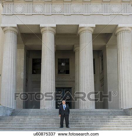 Stock Photo - "Businessman standing on stairs, Valparaiso, Chile". Fotosearch