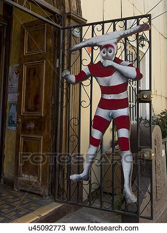 "Clown hanging from a wrought iron door, Valparaiso, Chile" View Large Photo Image Stock Image - "Clown hanging from a wrought iron door, Valparaiso, Chile". Fotosearch