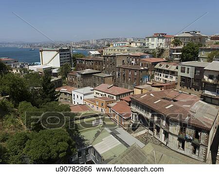 Stock Photograph - "Elevated view of buildings and ocean inlet, Valparaiso, Chile". Fotosearch