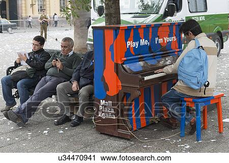 Stock Image - "Man playing piano on street, Santiago, Santiago Metropolitan Region, Chile". Fotosearch