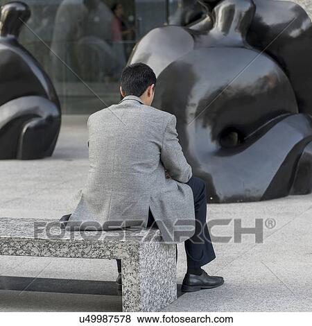 "Man sitting on bench, Santiago, Santiago Metropolitan Region, Chile" View Large Photo Image Stock Photo - "Man sitting on bench, Santiago, Santiago Metropolitan Region, Chile". Fotosearch