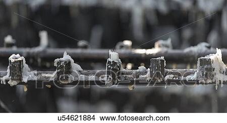 Picture - "Metal candle holder with melted wax, San Cristobal Hill, Santiago, Santiago Metropolitan Region, Chile". Fotosearch