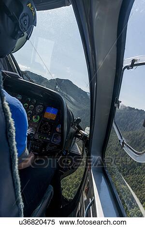 "Pilot flying a helicopter, Skeena-Queen Charlotte Regional District, Haida Gwaii, Graham Island, British Columbia, Canada" View Large Photo Image Stock Photography - "Pilot flying a helicopter, Skeena-Queen Charlotte Regional District, Haida Gwaii, Graham Island, British Columbia, Canada". Fotosearch