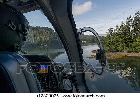 "Pilot flying Sikorsky Helicopter, Skeena-Queen Charlotte Regional District, Haida Gwaii, Graham Island, British Columbia, Canada" View Large Photo Image Stock Photography - "Pilot flying Sikorsky Helicopter, Skeena-Queen Charlotte Regional District, Haida Gwaii, Graham Island, British Columbia, Canada". Fotosearch