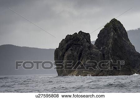 Stock Photo - "Rocky Island in the Pacific Ocean, Skeena-Queen Charlotte Regional District, Haida Gwaii, Graham Island, British Columbia, Canada". Fotosearch
