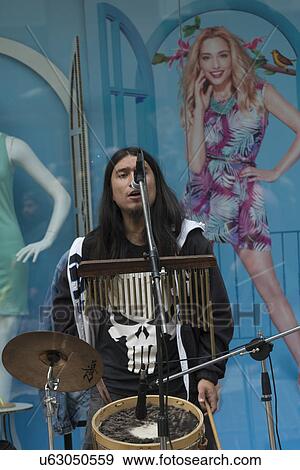 "Street musician singing and playing drum, Santiago, Santiago Metropolitan Region, Chile" View Large Photo Image Stock Photo - "Street musician singing and playing drum, Santiago, Santiago Metropolitan Region, Chile". Fotosearch