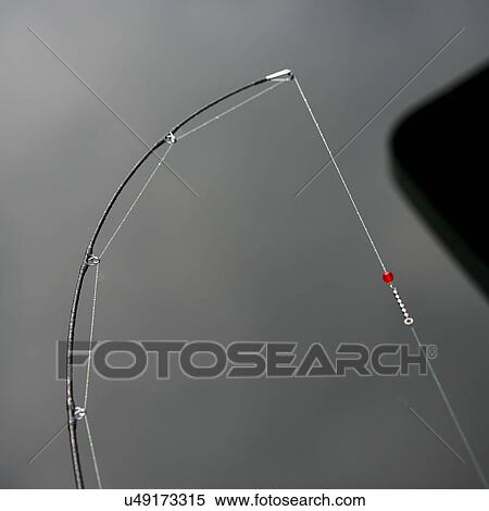 "View of a bent fishing rod, Skeena-Queen Charlotte Regional District, Haida Gwaii, Graham Island, British Columbia, Canada" View Large Photo Image Stock Photography - "View of a bent fishing rod, Skeena-Queen Charlotte Regional District, Haida Gwaii, Graham Island, British Columbia, Canada". Fotosearch