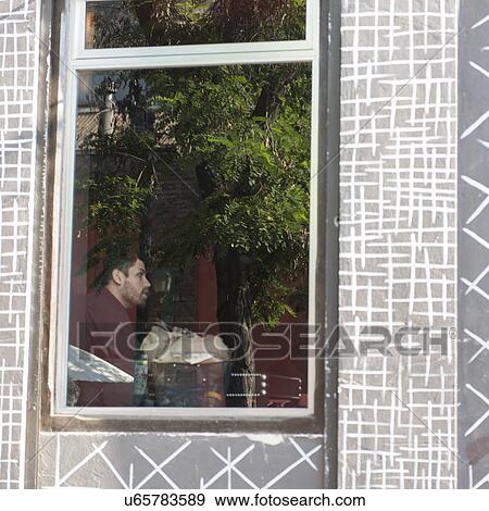 "View of a man through window, Santiago, Santiago Metropolitan Region, Chile" View Large Photo Image Stock Photo - "View of a man through window, Santiago, Santiago Metropolitan Region, Chile". Fotosearch