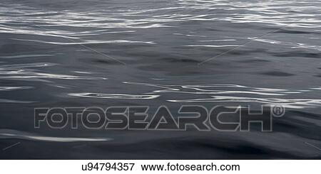 Stock Photo - "View of ocean surface, Skeena-Queen Charlotte Regional District, Haida Gwaii, Graham Island, British Columbia, Canada". Fotosearch