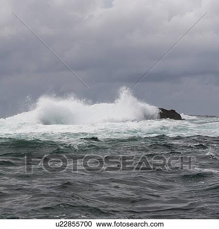 Stock Image - "Wave breaking at coast, Skeena-Queen Charlotte Regional District, Hippa Island, Haida Gwaii, Graham Island, British Columbia, Canada". Fotosearch