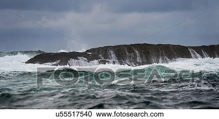 Stock Image - "Waves breaking on an island, Skeena-Queen Charlotte Regional District, Haida Gwaii, Graham Island, British Columbia, Canada". Fotosearch