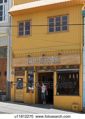 "Woman standing at doorway of a restaurant, Valparaiso, Chile" View Large Photo Image Stock Image - "Woman standing at doorway of a restaurant, Valparaiso, Chile". Fotosearch