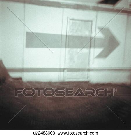 Art photograph of an arrow sign on building View Large Photo Image Stock Image - Art photograph of an arrow sign on building. Fotosearch