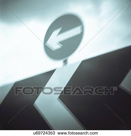 "Art photograph of arrow road sign, low angle view" View Large Photo Image Stock Image - "Art photograph of arrow road sign, low angle view". Fotosearch