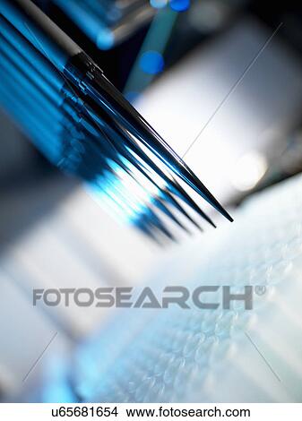 Automated chemical sampler in action used to test chemical and dna samples View Large Photo Image Picture - Automated chemical sampler in action used to test chemical and dna samples. Fotosearch