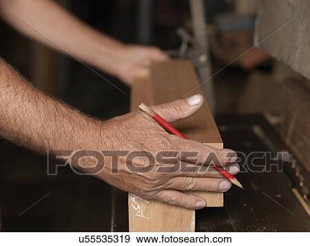 Stock Photo - Boat builder at work. Fotosearch